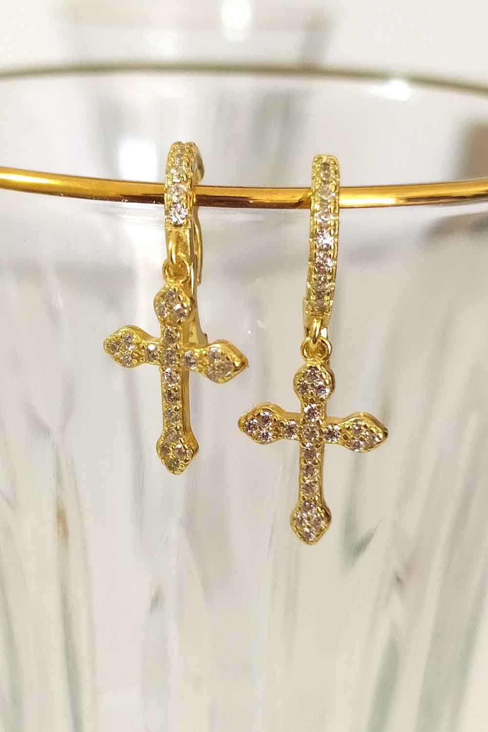 Hoop earrings with crosses. Sterling silver jewelry with 18k gold plating.